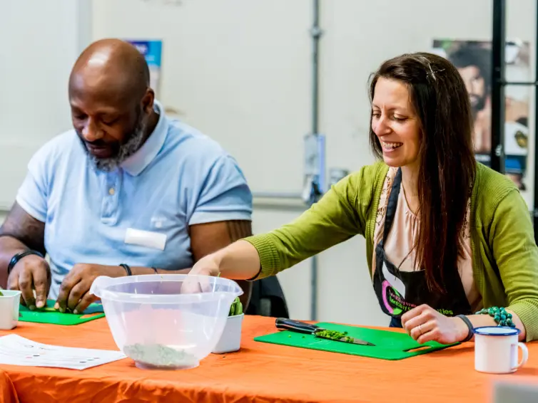 People sat down and participating in cooking exercises.