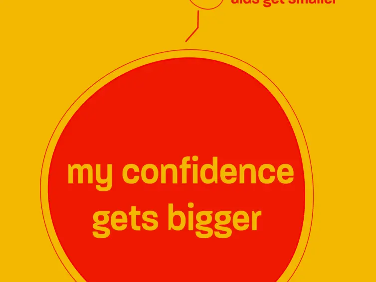 An orange poster with a big red circle and an illustration of an hearing aid. Words on the poster say: as hearing aids get smaller, my confidence gets bigger.