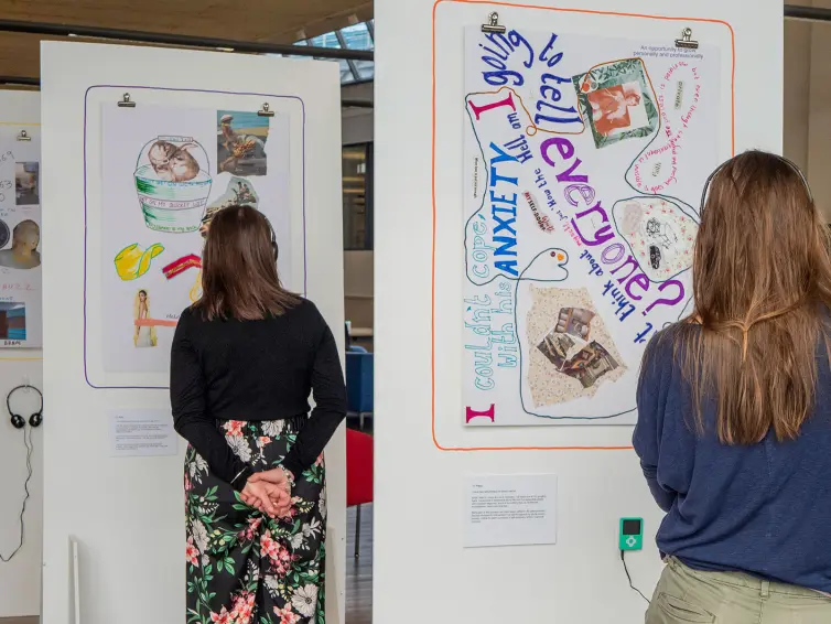 Two people listening to audio stories.